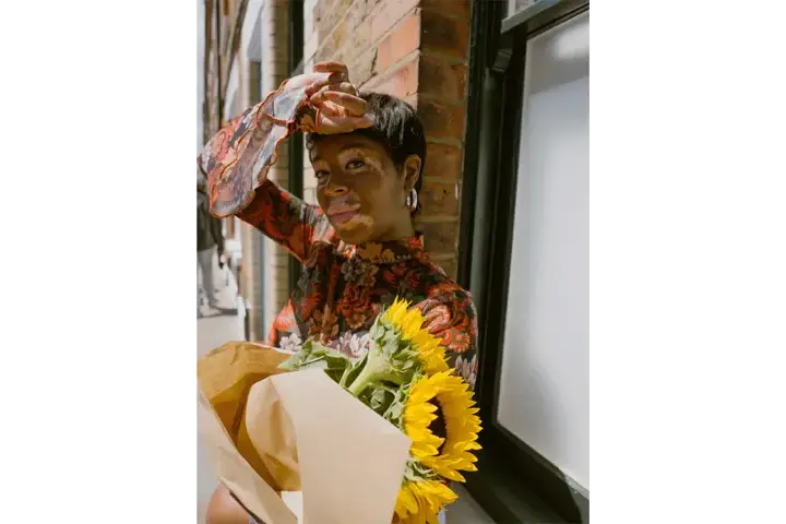 Portrait of a woman with sunflowers
