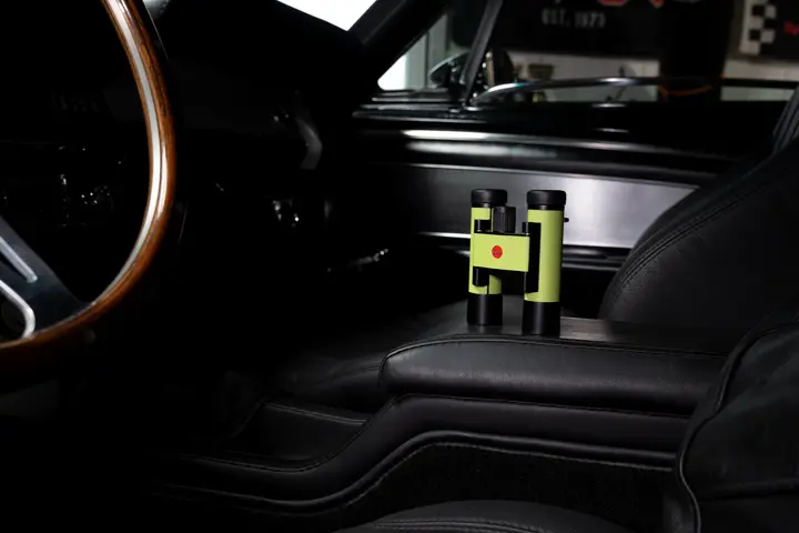 The Leica Ultravid Compact in the color apple green in a vehicle