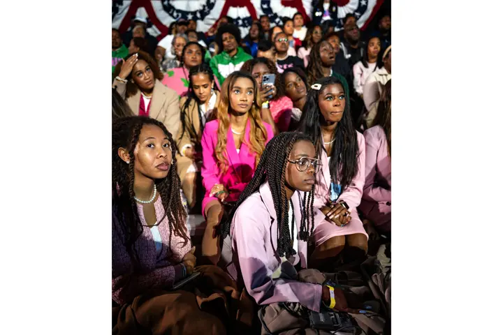 Group of young women listen to something
