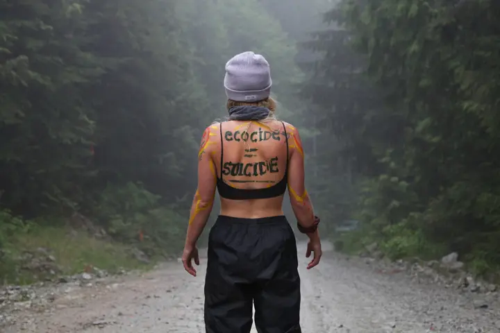 A woman appeared at a cut block to show her unity with land defenders