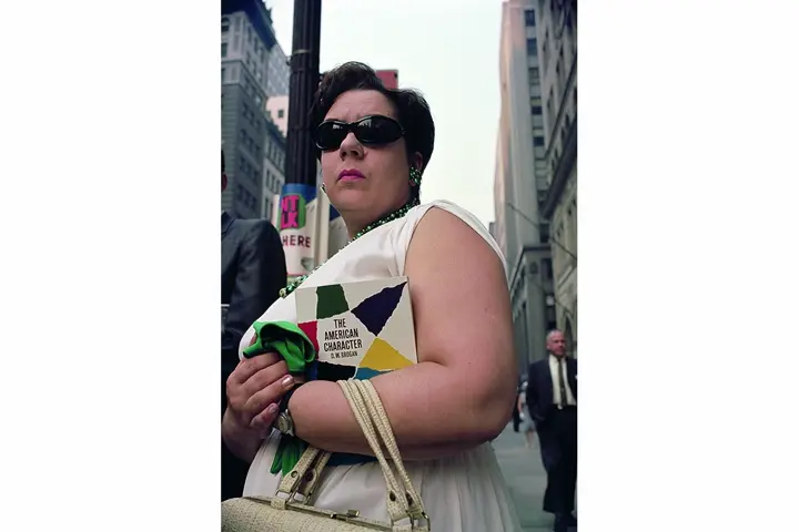 Woman with Magazine and sunglasses in city