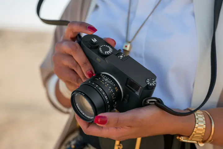 Woman with a Leica Camera in her hands