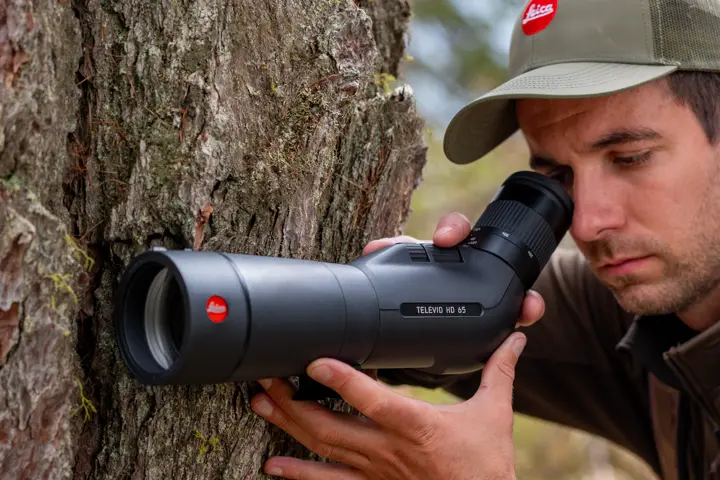 Man is looking through his Leica Televid HD spotting scope