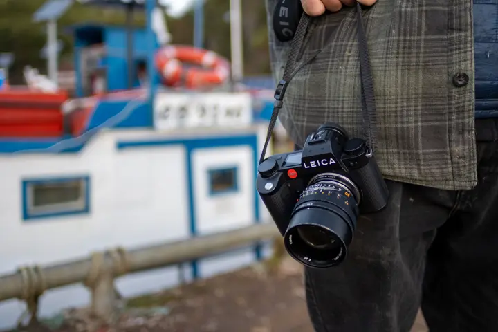 Man with his Leica camera at the harbour.