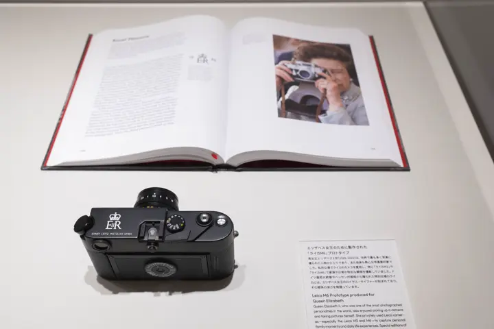 100 years of leica Tokyo, leica camera and a book on a table