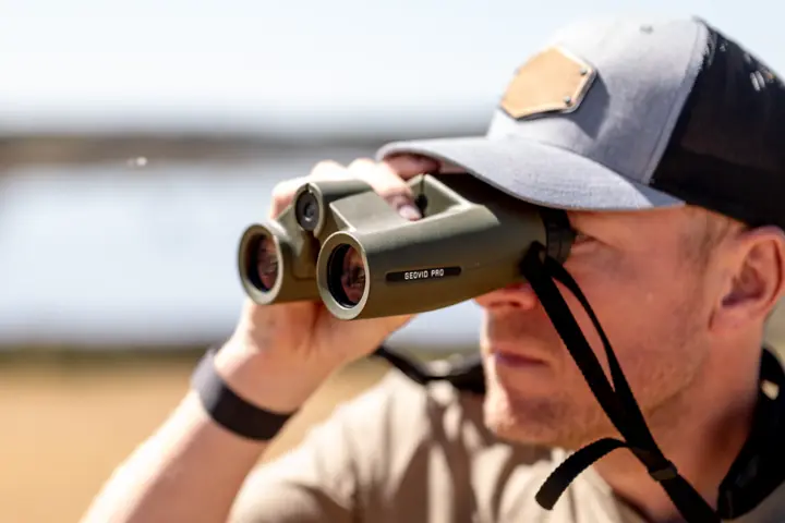 Hunter is looking through his Leica Geovid Pro 10x32 Edition Green