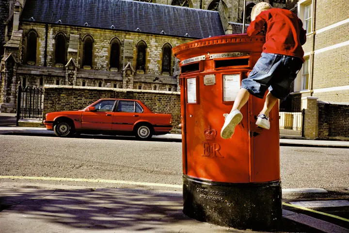 Kid on postbox