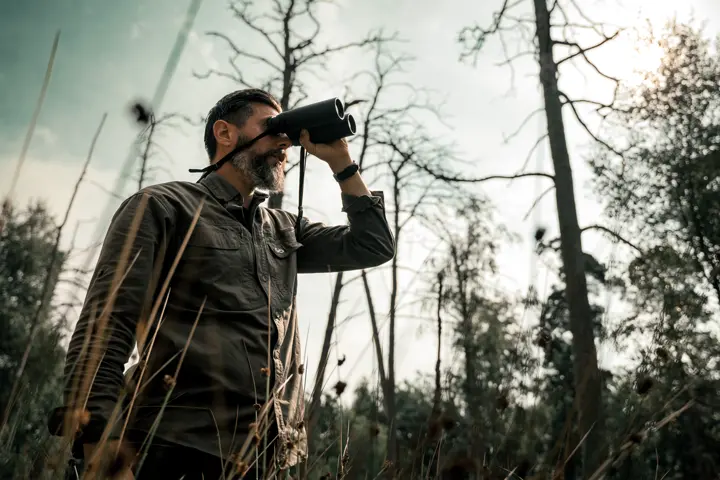 Hunter is looking through his Leica Geovid R