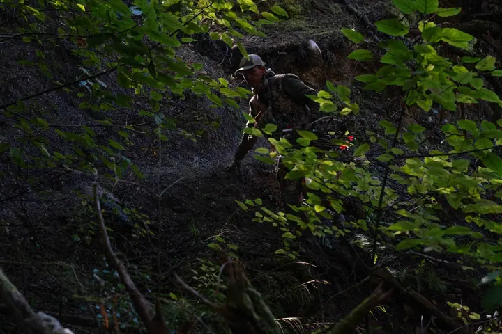 Hunter in the rain forest of New Zealand
