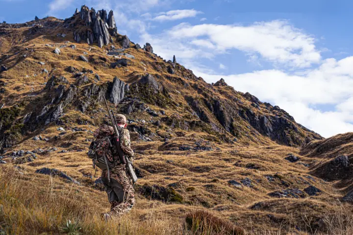 Hunter stalking in the mountains