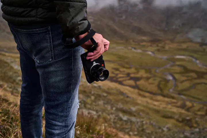Roland climbing, Leica M EV1 by his side