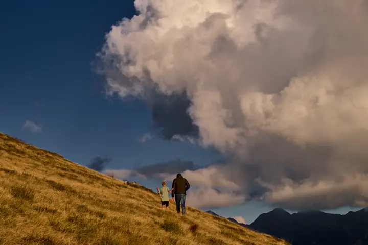 Roland walked with his son, sunlight falling around them