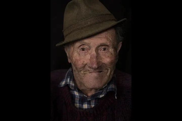 a Gaze of a farmer with smile