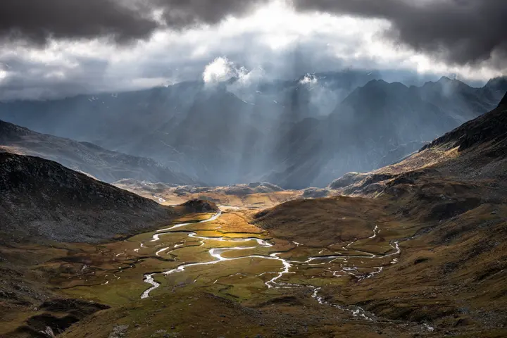 Sunlight pierces through the clouds