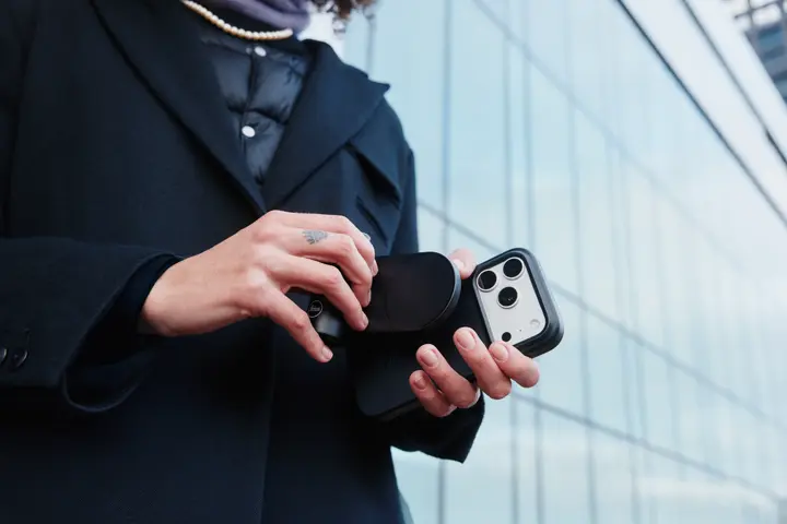 Woman attaches LUX Grip to her iPhone with LUX Case