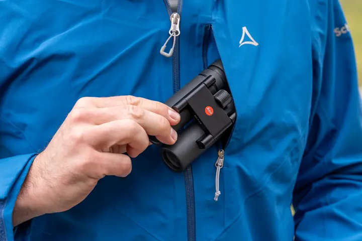 Man pulls his Leica Noctivid out of his pocket