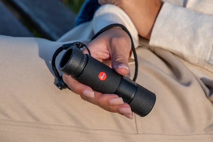 Woman is holding her Leica Monovid