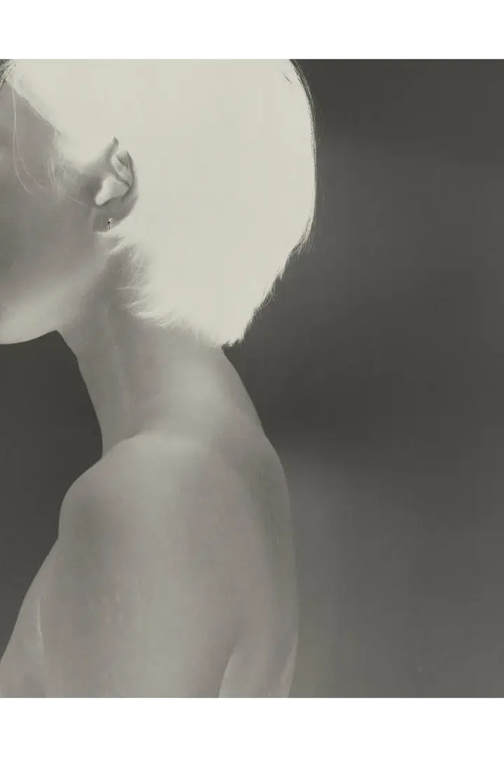 Inverted Black and white image of a Woman.