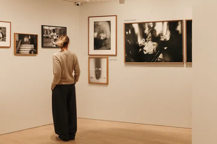 Woman standing in the leica gallery milan