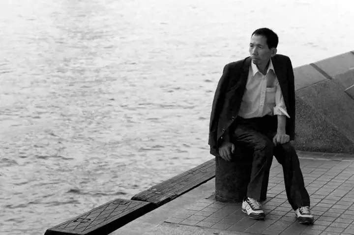 male model sitting and posing black and white