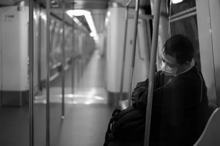 man sleeping in sub black and white