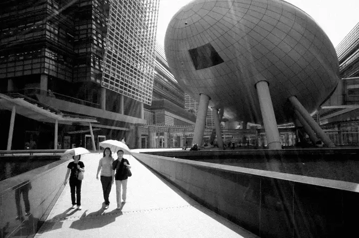women walking on street b&w