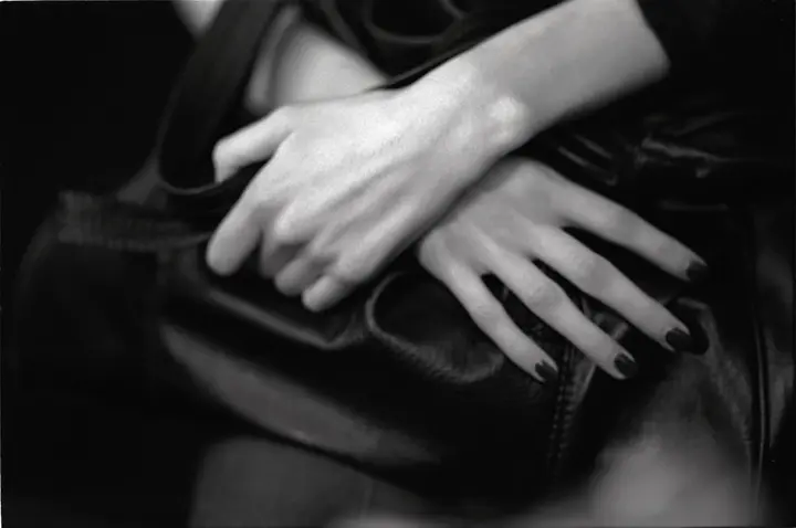 Her hands folded in her lap