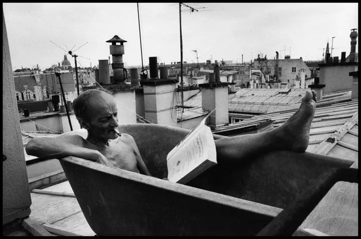 old man chilling in bathtub b&w