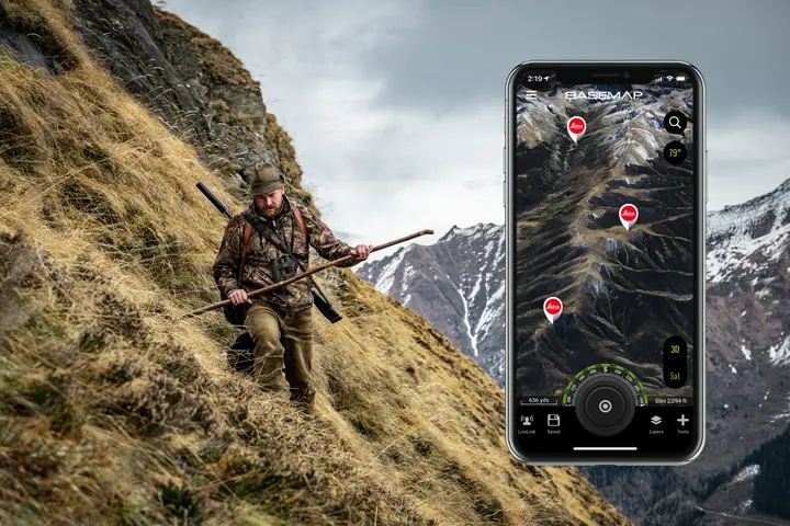 Hunter with his Leica Geovid Pro in the mountains using Leica ProTrack