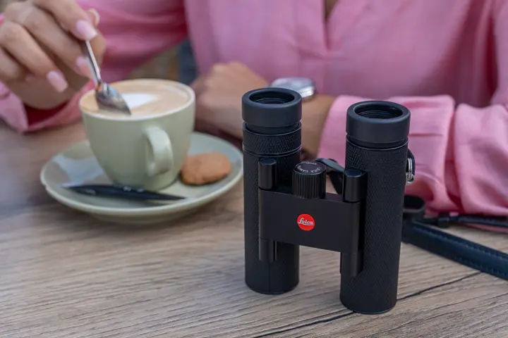 Leica Noctivid Compact on a coffee table