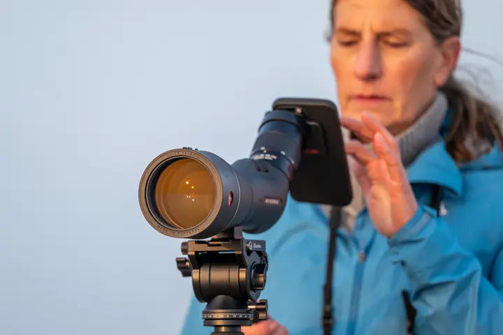 Woman using her Leica APO-Televid with digiscoping