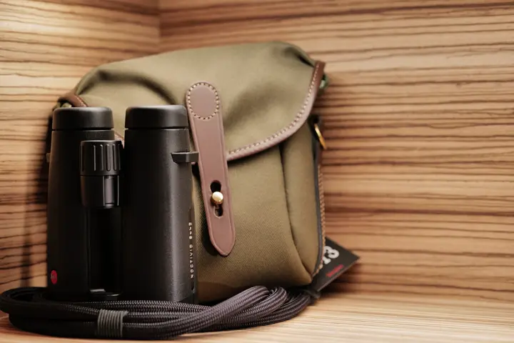 Colour image of a Noctivid with a Billingham bag on display shelf.