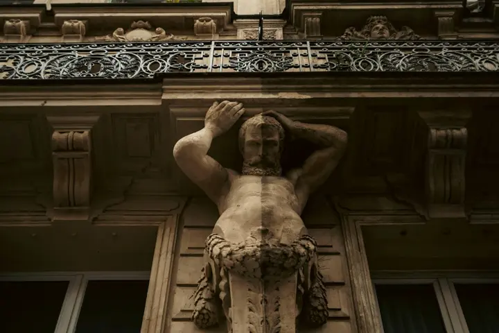 A sculpture on the outside of a building