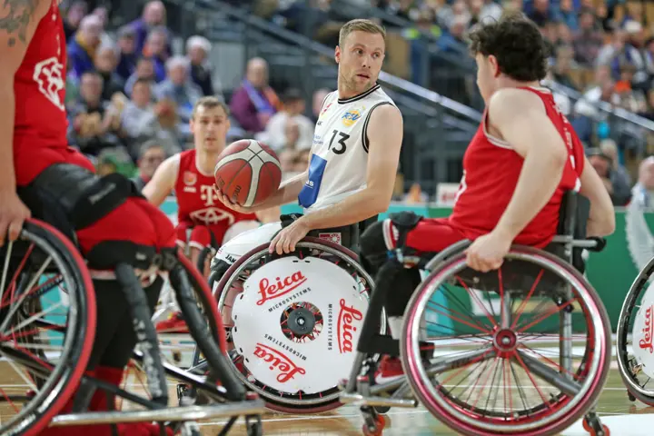Wheelchair basketball players competing during a game.