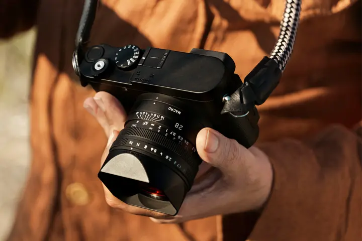 Close-up of a hand holding a Leica Q3 Monochrom 