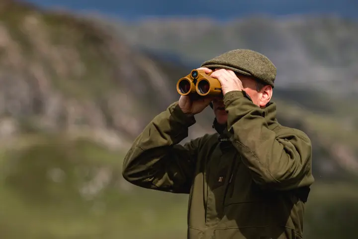 Hunter is looking through his Leica Geovid Max