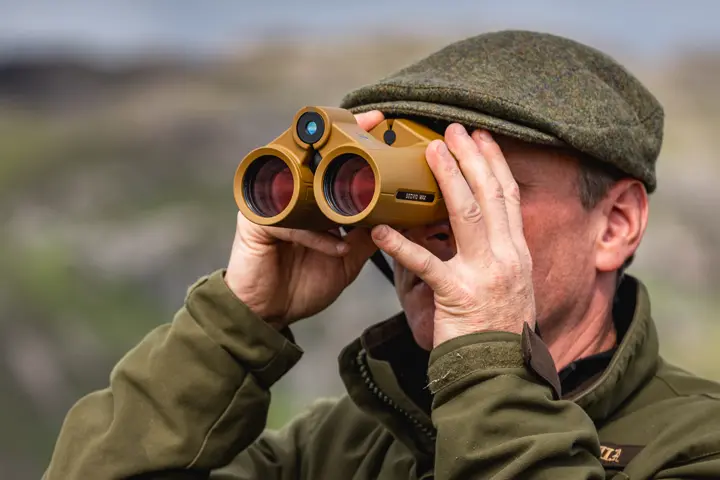 Hunter is looking through his Leica Geovid Max