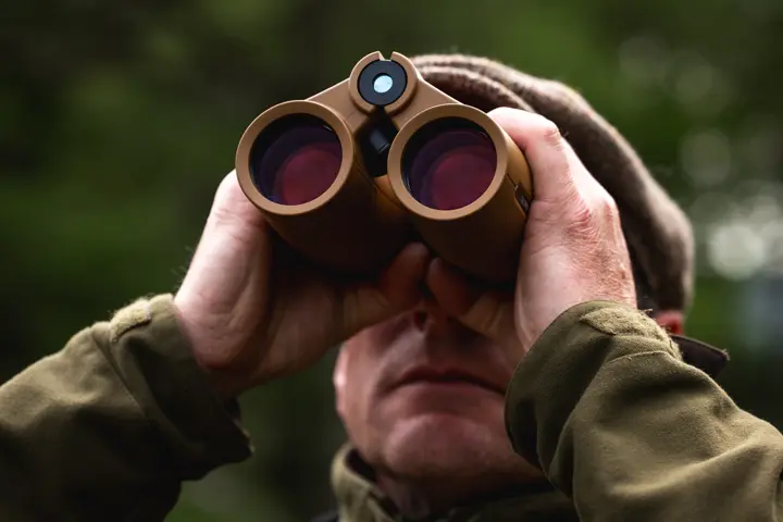 Hunter is looking through his Leica Geovid Max