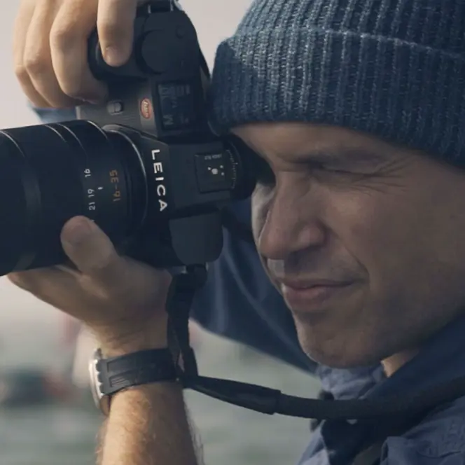Close-up of a man taking a picture.