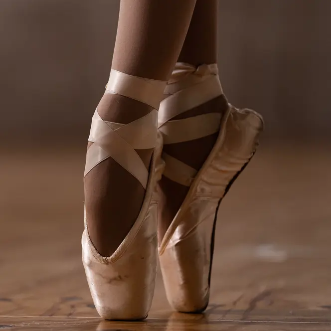 Close-up of a ballerina's feet in ballet shoes. 