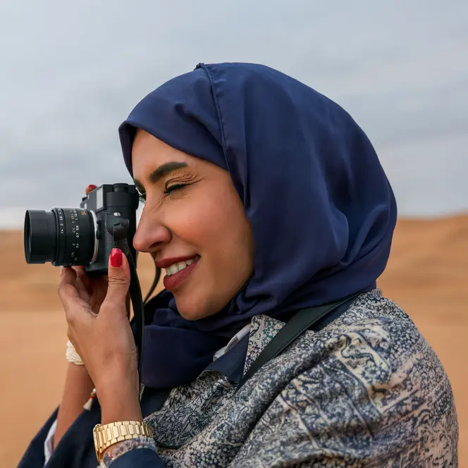 Woman with a Leica M11-Monochrom in the desert