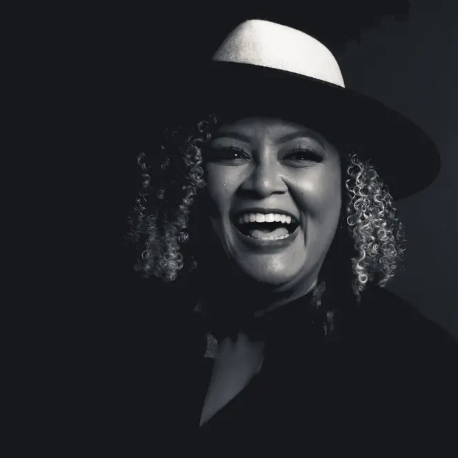 Portrait of a smiling woman wearing a hat