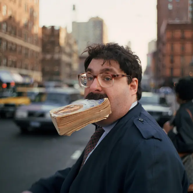 Man with a book in his mouth