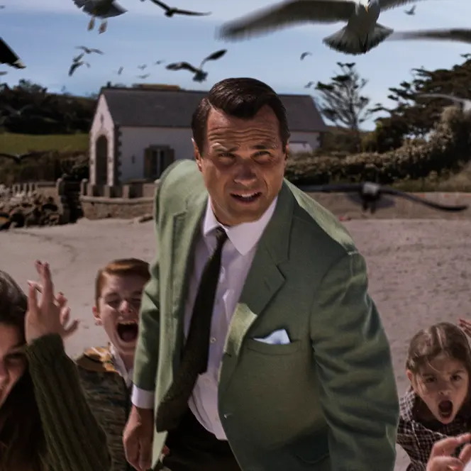 A man and five kids running away from crows 