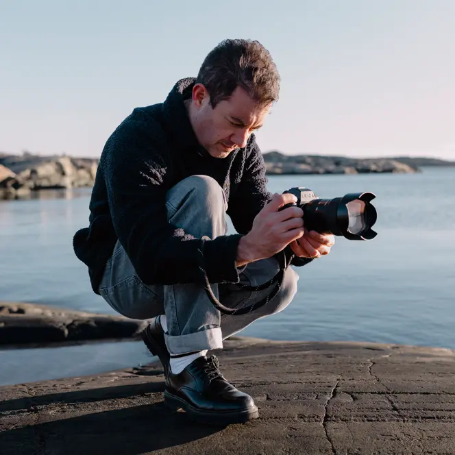 A person is taking photographs with the Leica SL3-S.