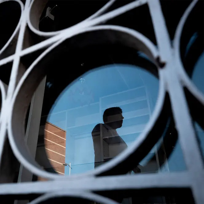 Reflection of a man in a building
