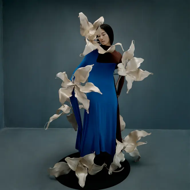 Woman in a blue dress with big flowers