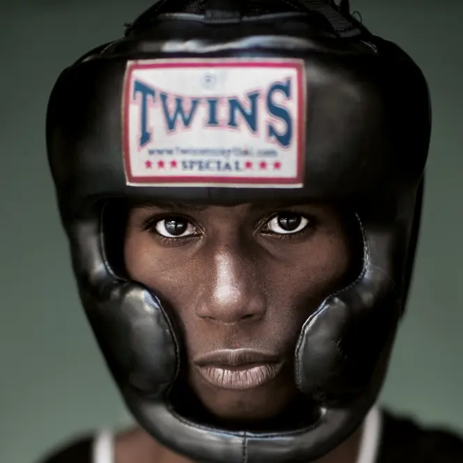 Portrait of a black boxer wearing a boxing helmet