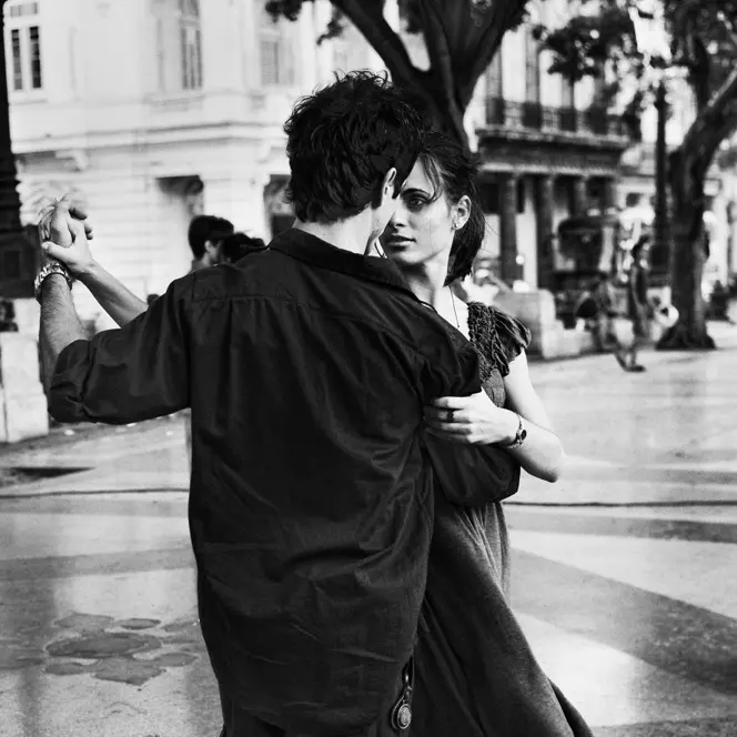 Couples dancing tango on Paseo del Prado in Havana, Cuba, captured in expressive black-and-white street photography.