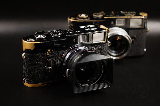 Leica M4 Black Paint with another vintage camera in the background.